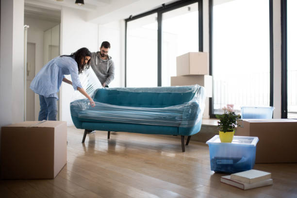 Couple moving furniture | Westport Flooring