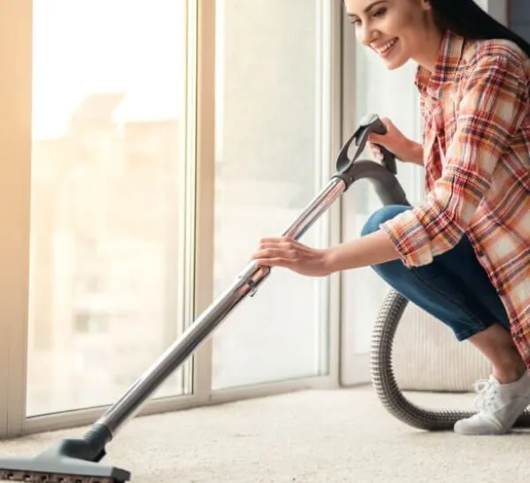 Woman-cleaning-carpet | Westport Flooring and Interiors